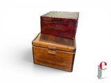 three wooden boxes stacked on top of each other on a white surface