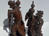 pair of asian figurines of a man and a woman