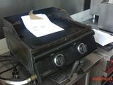 a stove that has a paper on top of it