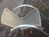 an image of a chair and table on a sidewalk