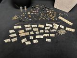 a black table topped with lots of different types of jewelry