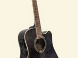 an image of a black acoustic guitar sitting on top of a white surface