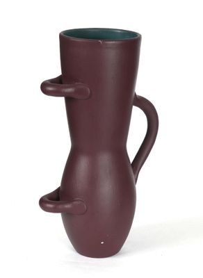 a brown vase with a handle on it