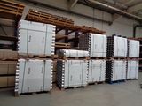a large amount of boxes stacked on pallets in a warehouse