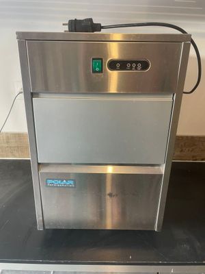 an image of a stainless steel ice maker on a counter