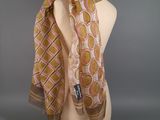 a close up of a mannequin head with a scarf on it