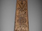 an image of a long piece of wood with a design on it