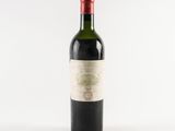 a bottle of wine that is sitting on a table
