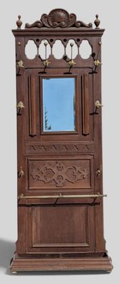 a tall wooden cabinet with a mirror on top of it