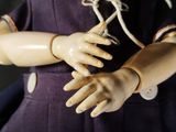 a doll that has two hands on it ' s arm