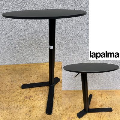 a black table with a black base and a black table top