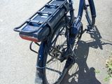 a blue bicycle with a basket on the back of it