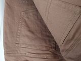 the back of a pair of brown pants with a label on it