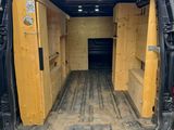 the back end of a van with the door open and the back door open
