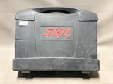 a small gray tool box with the word skil on it
