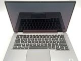 a silver laptop with a black keyboard sitting on a table