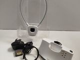 a small white device with a charger and a charger