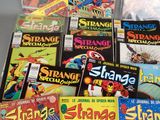 a lot of comic books sitting on a table