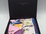 a black box with a pink, yellow, and blue handkerchief in it