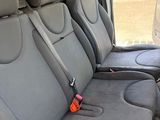 four seats in the back of a van that are empty
