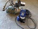 an image of a water pump and a hose on the floor