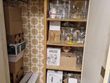 a pantry with a lot of boxes and boxes on the shelves