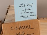 boxes of books are stacked on top of each other with a sign on top of them