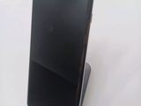 a cell phone that is sitting on top of a stand