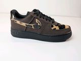 the nike air force 1 low leopard print sneaker has a black sole and a leopard print on the upper