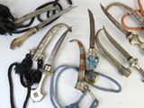 many different types of knives that are on the table