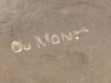 an image of a close up of a silver vase with a name engraved on it