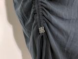 a close up of a woman ' s skirt with a zipper down the side