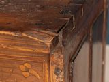 a close up of a wooden table with a clock on it