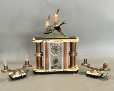 a clock that has a bird on top of it