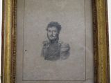 une vieille photo d'un homme barbu dans un cadre en or