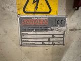 a warning sign on the wall of a building