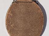 a picture of a brown purse with a skull on it
