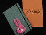louis vuitton notebook with a pink bunny face on the cover