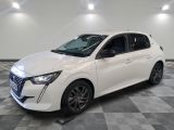 a white car is parked on a checkered floor in a garage