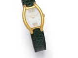 a close up of a watch on a white surface with a green strap
