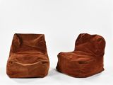 a pair of brown bean bags sitting on top of each other