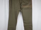 a pair of khaki pants hanging on a hanger