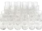 a lot of glasses that are sitting on a table