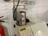 a machine that is sitting next to a fire extinguisher