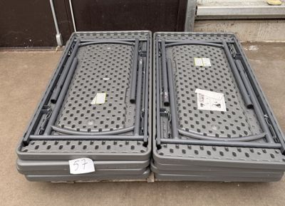 two plastic containers sitting on the ground next to each other
