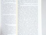 someone is holding a book open to a page with a picture on it