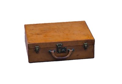 a small brown suitcase with a handle on a white background