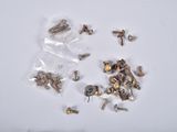 many different types of screws and nuts on the table