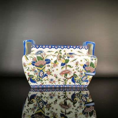 an image of a vase with a floral design on it