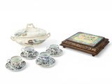 a tea set with a tray and cups and saucers